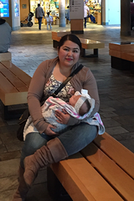 Tiffany Ayala with her adopted baby, Melody Rose, at the Monterey Bay Aquarium.