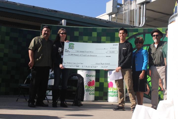 Alisal High School students and staff  gathered more than 16,000 pounds of food to donate to this years food drive. - Left corner Ernesto Garcia and Cathy Montero, Right Bryan Vargas, Sandra Ocampo, Phillip Tabera 




