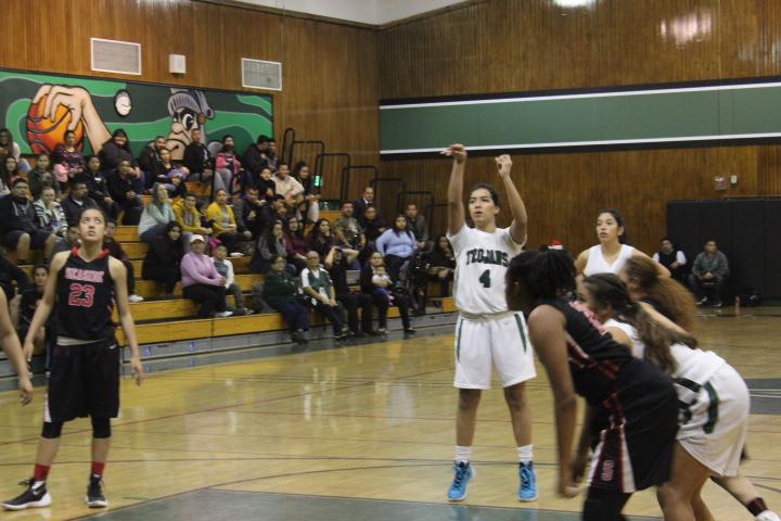 She+shoots%2C+she+scores.+Sophomore+Karely+Apodaca+makes+a+free+throw+against+the+Seaside+Spartans.+A+game+that+went+in+favor+of+the+Trojans+59-43.%0A