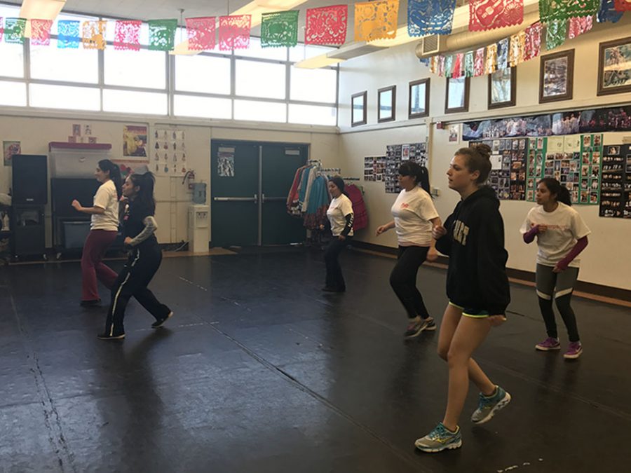 All Girls Workout Camp being led by Dalilah Alvarado for the zumba class with Ms. Baldwin dancing side by side with them.
