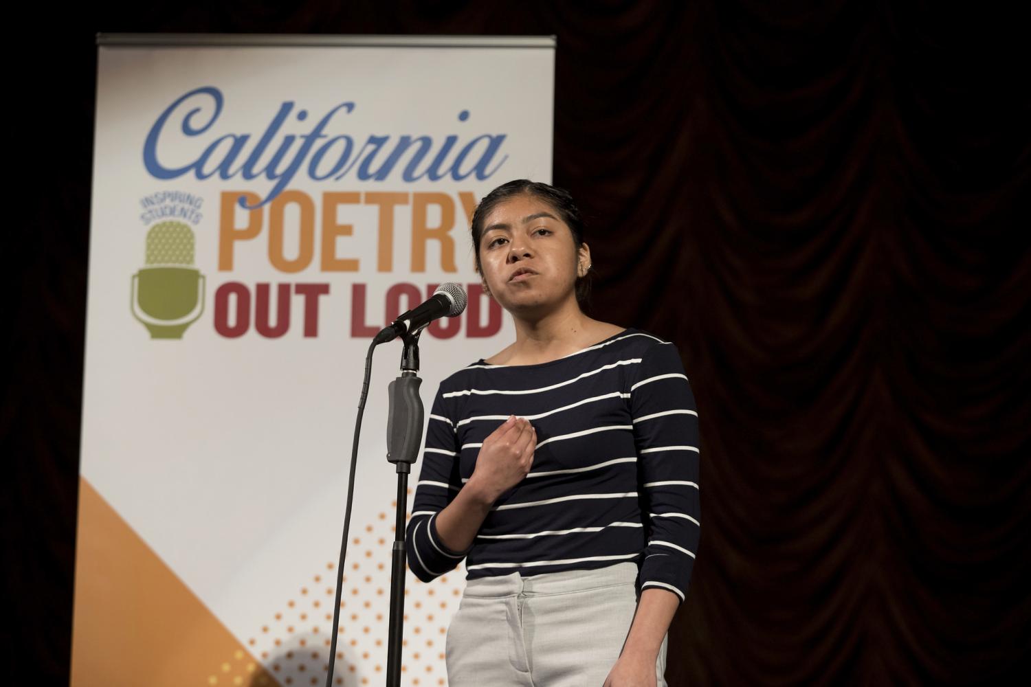 Florencia recites bent to the Earth in the third round of the Poetry Out Loud State competition.