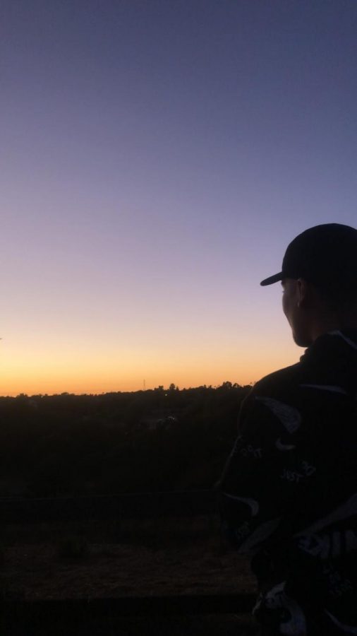 Senior Ivan Juarez enjoying a nice sunset on top of a hill in Las Casitas Park last summer. He said he likes it because theres a bench on top of a hill and it is really beautiful there.”