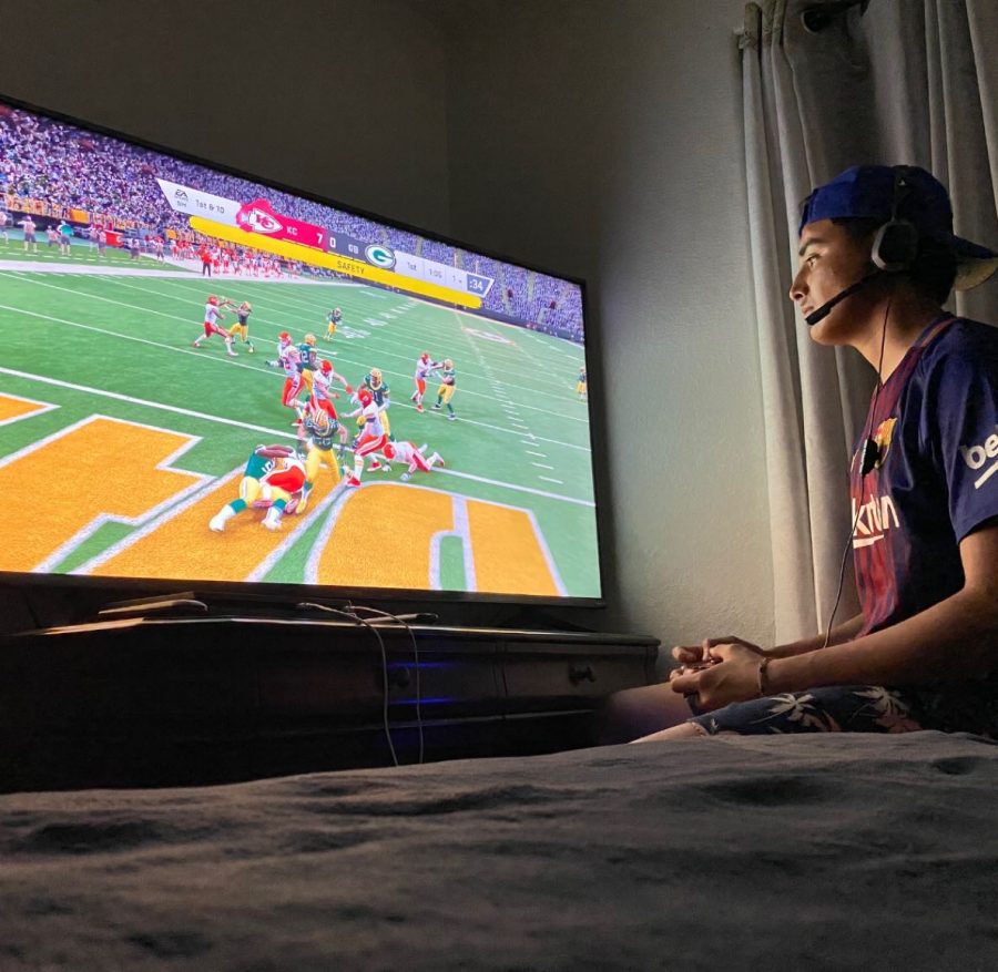 Senior Luis Tena playing his favorite game Madden to pass the time.