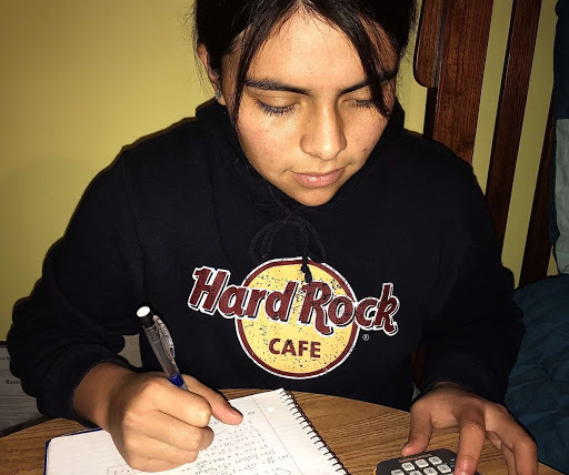 Senior Mikaela Arista is concentrating on her AP Calculus homework. “I enjoy doing math homework, especially now that I’m taking calculus. Though there are certain parts of the curriculum that give me a challenge, the best part is working through it and feeling successful when I finally get the right answer,” she says. 