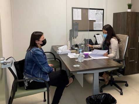 Caption for picture: Maria Coyt , a SSW intern. consults with Lorena Sanchez about a curriculum to begin a coping skills therapeutic group. We have groups available (i.e. grief/loss, coping skills, empowerment, etc.) and also able to provide individual counseling if needed, Sanchez said.
