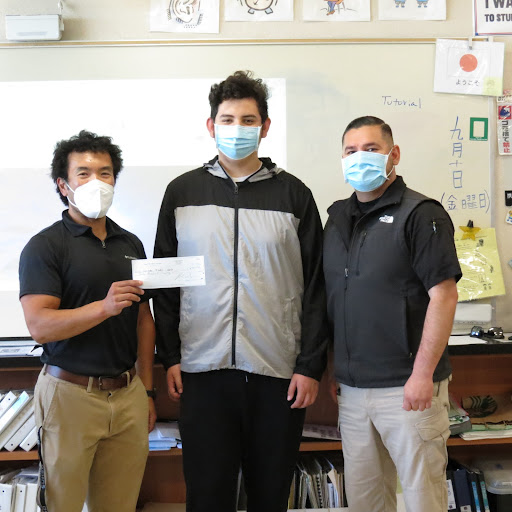 Ryoji Bunden and Officer Garcia present a scholarship check to Damian Macias for his commitment to the Kendo Club and Dojo. The scholarship came courtesy of the Salinas Police Officers Association and will cover Macias’ Salinas Kendo Dojo expenses, as well as his Northern California Kendo Association dues, and All US Kendo Association dues for 1 year. 
