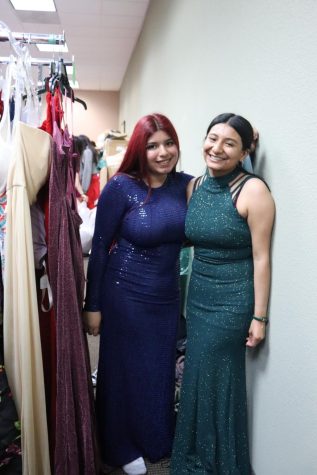 Seniors Arleth Moya and Jocelyn Oros trying on dresses from the Princes Project. “There were a lot of options, it was fun seeing every girl find a dress they liked.” Oros said. 