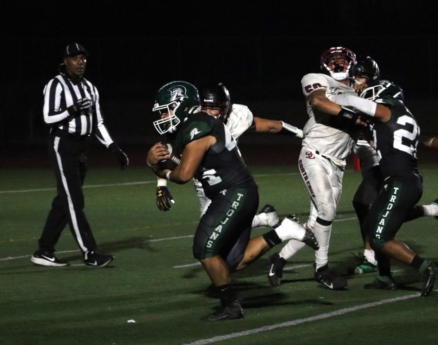 In the Homecoming game versus Santa Cruz, fullback Diego Chaidez rumbles into the endzone for a touchdown. The Trojans dominated the Cardinals, 42-19.