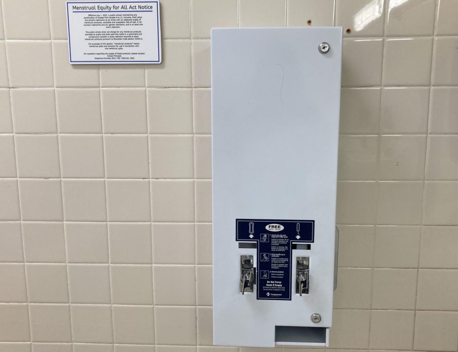 Dispensers like this are now available in every girls bathroom on campus, thanks to the Menstrual Equity for All Act. Tampons and pads are both available.