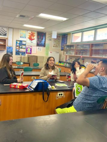 During lunch in room 726,  juniors Danielle Gurrero, Ilana Mendez, Izabella Ocampo, and senior Eron Rosales-Ayala had a good time playing UNO cards at the October 21st meeting. “UNO is a fun game to play.  Its even more fun to have a whole lot of decks,” Guerrero  said. 