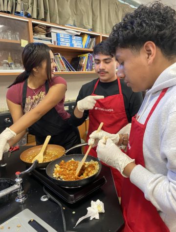 At their first meeting, Nathalie Lopez, Kevin Alejo, and Yovanny Virgen-Gomez prepare their mixture of potatoes and soyrizo. They first let the potato cook thoroughly, before adding the soyrizo into the mix. “It tastes exactly like a regular breakfast burrito and I was amazed to know that something that good was actually healthy,” Lopez said.
