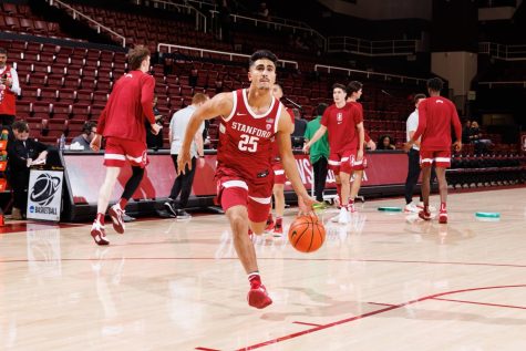 Warming up before the Stanford-Oregon State game, Josue Gil-Silva drives in for a layup during warmups. Gil-Silva earned a spot on the team and got the opportunity to play in four games this season. “It’s been amazing, I have been able to play four games so far. Something I would not have been able to manage last year ago,” he said.