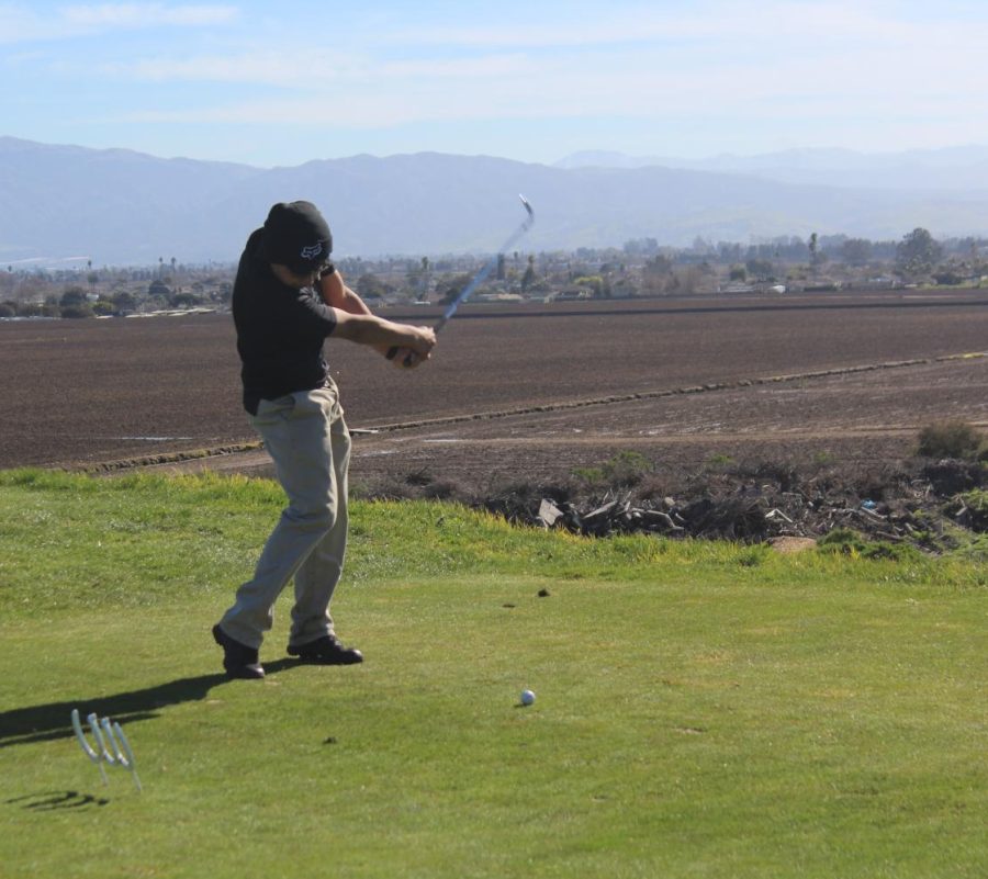 Junior Diego Calderon gets a practice swing in at hole 4 in the season opener at Crazy Horse Ranch.  The team finished in the middle of the pack in league, coming in 4th in the league finals, but Calderon was optimistic about the future.  “We’ll have a stronger team next season since we are experienced now,” he said.