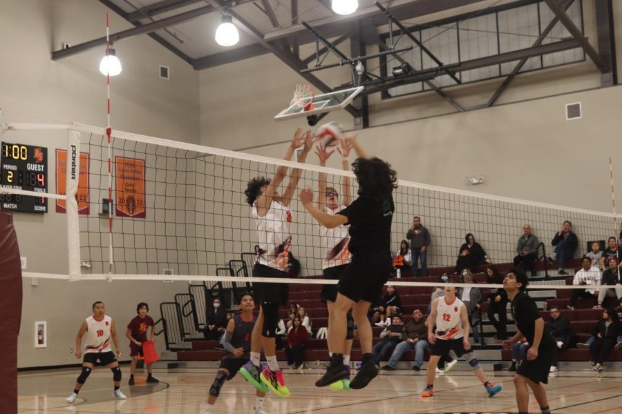 In the first matchup with Ranch San Juan, outside hitter Jesus Acevedo goes up for a spike against two blockers. Acevedo carried the team with the most hits and kills throughout the match, which they lost 2-3. “I knew that I could have performed better but Im overall proud of my performance,” Acevedo said.  In the rematch, the team got revenge at home, winning 3-2.
