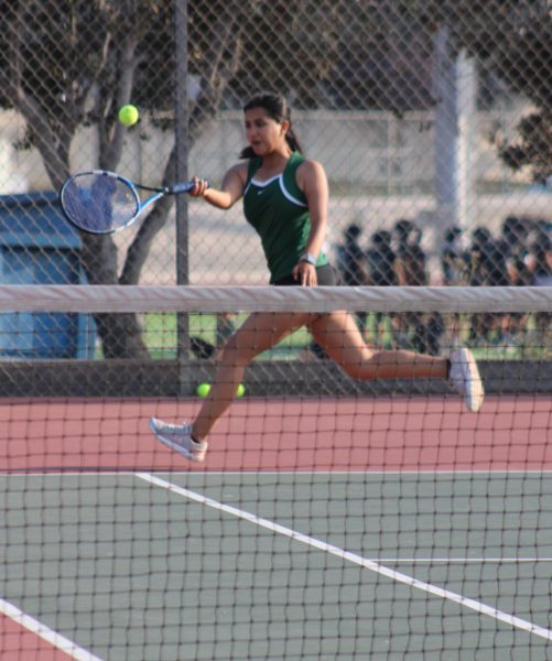 Against Gonzales, senior Emily Lopez hits a forehand return in the first set of her singles match. The team dropped the match to Gonzales, which was only their second loss on the season. “I played first singles and I won so I was surprised,” Lopez said.