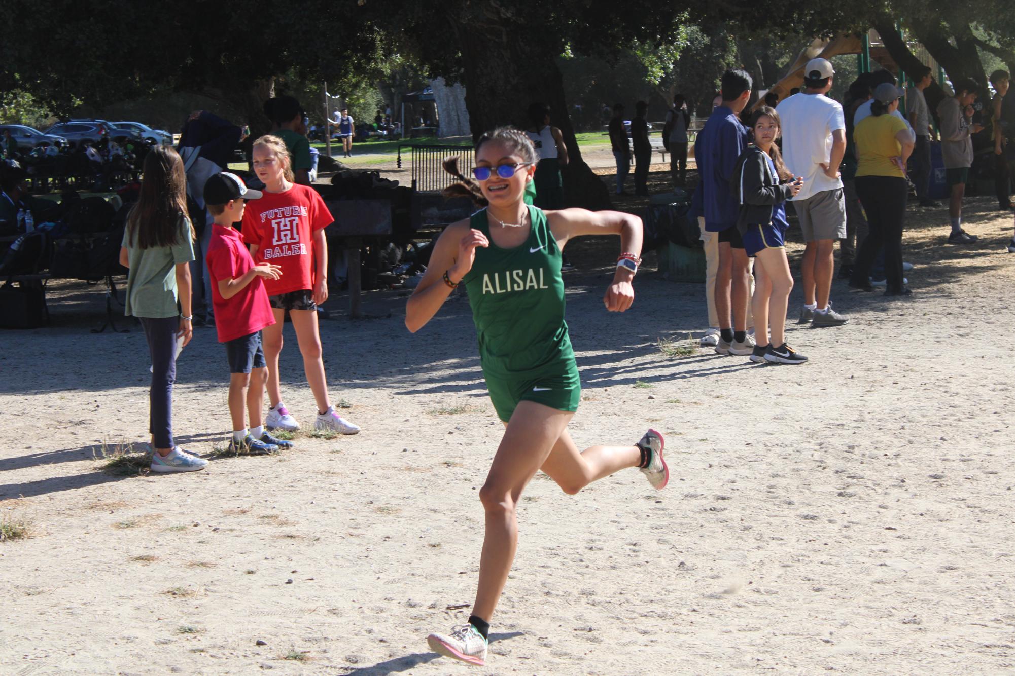 During Center Meet 2 at Toro Park, sophomore Erika Castro sprints to the end of the race. “I felt tired, I started sprinting because the coach yelled at us to sprint,” Castro said. The girls were able to place third overall. 