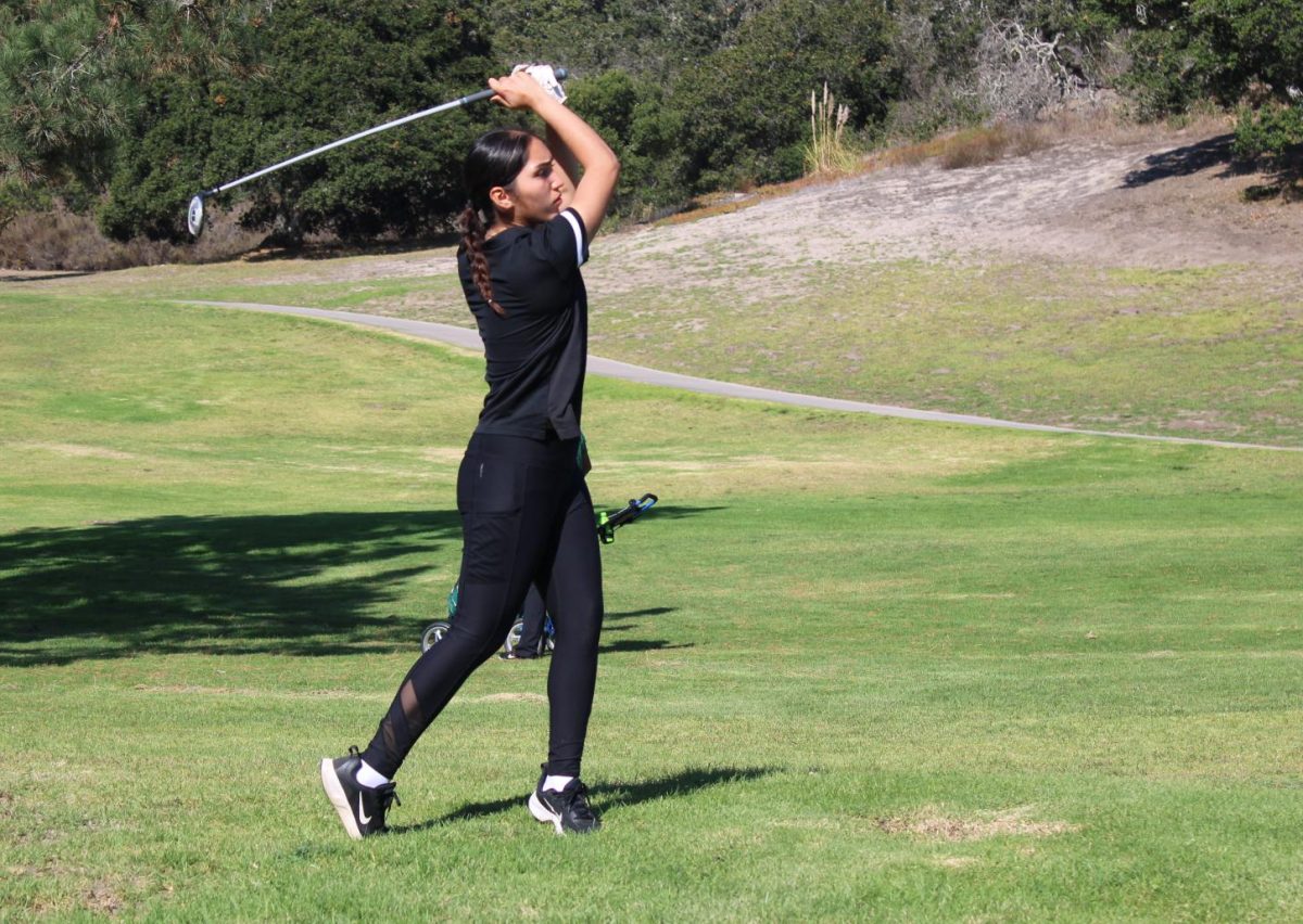 At+the+PCAL+Championship%2C+senior+Ilana+Mendez+hits+a+drive+on+the+13th+hole+at+Laguna+Seca+golf+course.+The+team+would+place+1st+in+the+Mission+Division+with+a+score+of+628%2C+and+finish+8th+overall.+%E2%80%9CI%E2%80%99m+definitely+proud+of+my+team+because+we+have+a+lot+of+new+players+and+they+all+did+amazing%2C%E2%80%9D+Mendez+said.