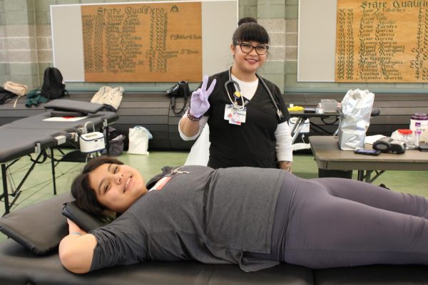 After successfully donating blood, junior Cristal Alvarez goes through the recovery process with the help of nurse Kathy Consule. “I feel like Im very blessed to have so much blood,” Alvarez said. “A lot of people need it so Im not scared to donate my blood just to help people out.”