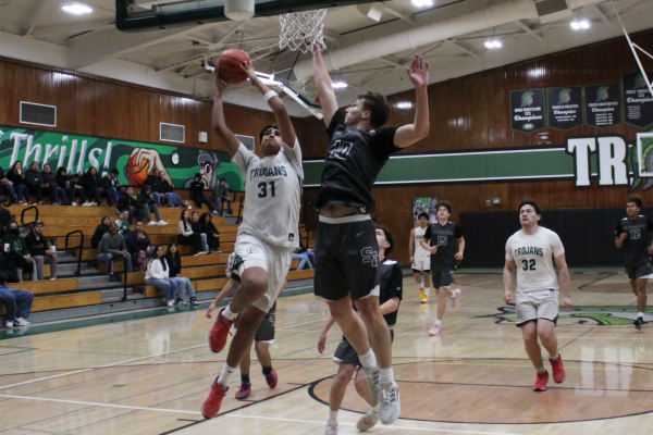 Against St. Francis, sophomore Christian Lopez scores after a rebound and sprinting across the empty court. Lopez finished with 8 points, while also contributing 11 rebounds, 3 assists, 2 steals, and 1 block to the 76-38 win.
