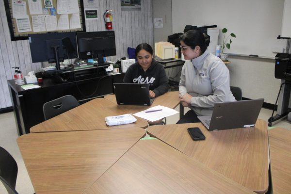 Dr. Ana Gutierrez assists senior Michelle Morales-Andrade in the college and career readiness center. Gutierrez and other counselors are helping students navigate the new 2024-2025 FAFSA application.
