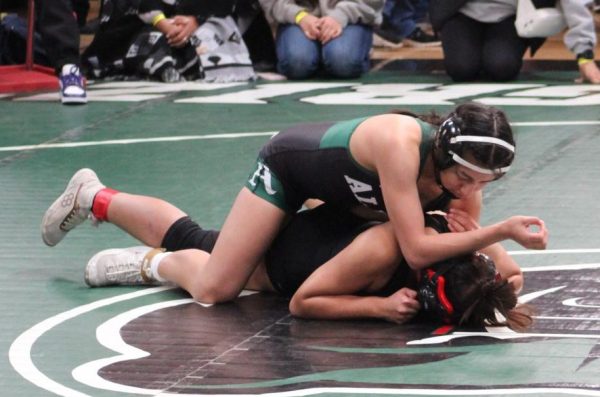 At CCS Masters, senior Joselin Hernadez cross-faces her opponent, in the second period. I put a half in and then I was able to pin her, winning the match, Hernandez said. I was nervous because it was CCS and it was right before State and you never know what could happen since Ive wrestled a lot of girls but not really from our area because we went to bigger and harder tournaments and most of the girls at CCS I hadnt wrestled before.