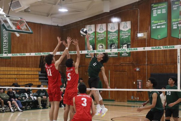 In the first preseason home game, Jonathan Murillo, captain and middle blocker, spikes against Hollister. The team put up a fight, taking Hollister to five sets but they came up short and lost 2-3. Despite Hollister being a strong team, Alisal still
had hope for competing with them in the future. I think we can beat them, Coach Ramos said. The Trojans are currently undefeated in league at 5-0.
