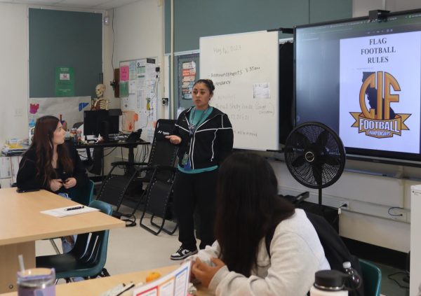 New flag football head coach Marisol Rasul met with prospective players in her room on May 16.  She went over some of the basic rules. “I’m so excited to have football for girls since we never had anything like this before,” sophomore Isabella Garcia said. 