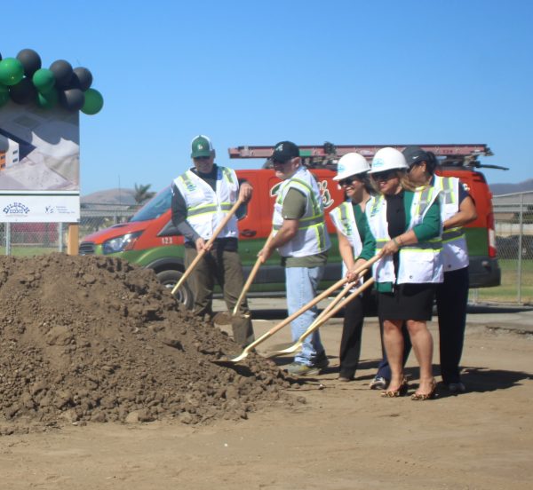 Principal Christina Perez-Parker leads a group in the ceremonial ground breaking for the new building., which should be completed in the next two years “The building will support the growing population of students, and help with a space issue we are facing for teachers and students."