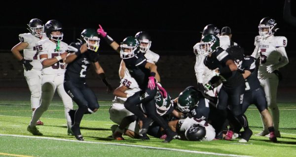 With the clock running down and the Trojans ahead 33-27, the defense stopped the Sharks at the goal line to seal the win. #1 Carlos Zamora celebrates the stop. “Our defense came up huge against St. Francis and I can't say enough at how proud I am of them as a group,” Coach Estrada said.