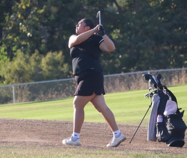 In a home match against Alvarez at First Tee, junior Alejandra Alvarez hits an approach shot with her 9-iron from the rough. Alvarez scored a 5 on hole 1 and had an overall match score of 35. The team won this match with a score of 231. Alvarez was named 1st Team All-League.