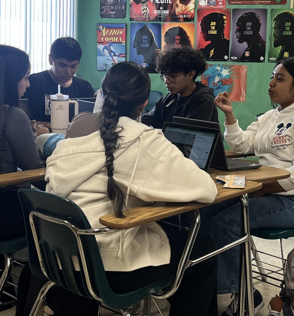 Coming to Alisal has been a positive change for me (black hoodie and glasses). Joining the Journalism/Yearbook class has helped my transition from Seaside High. At this point, I am doing well and I feel better than ever academically.