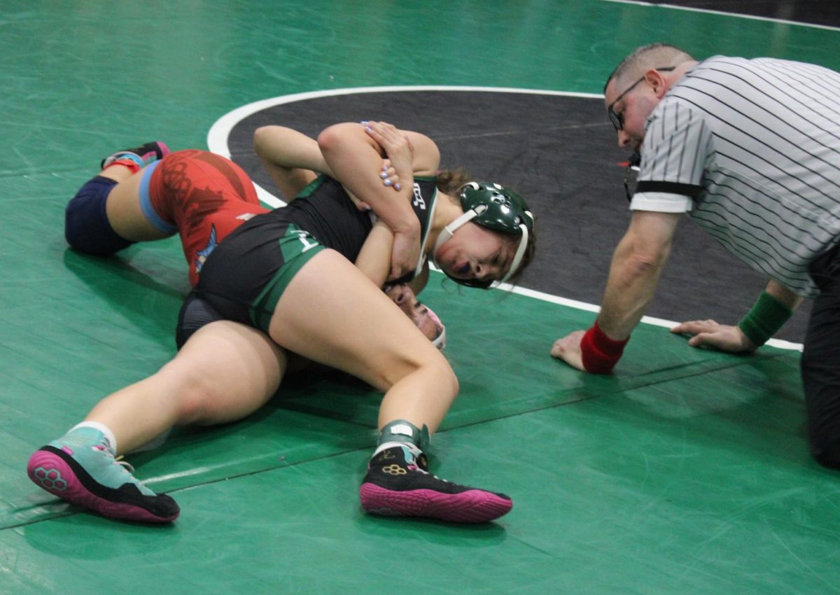 At the 12th annual Trojan Wrath, sophomore Vanessa Rocha pinned her opponent giving her the win. She comes into the season with one goal in mind - to make it to State. “Winning has shaped me into wanting more,” she said.  