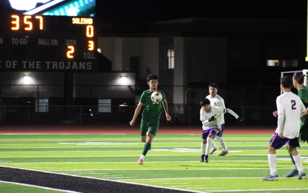 Bryan Mendoza-Vega skillfully takes control of the ball during a match against Soledad. The Trojans came out on top, 3-0.