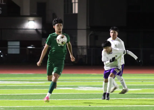 Bryan Mendoza-Vega skillfully takes control of the ball during a match against Soledad. The Trojans came out on top, 3-0.