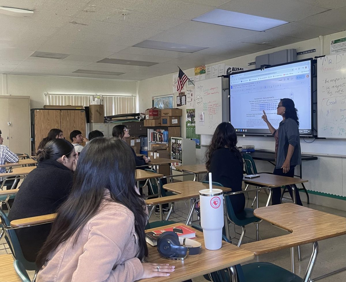 Junior English teacher Venetia Rivera  talking to her 4th-period class before starting the audiobook for Fahrenheit 451. One of her third-period students, Valeria Gonzalez, says that Rivera has helped make their connection stronger and she will miss her very much. “It hurts because there are people that are also in the Health Academy who won't get to experience a supportive person like that, encouraging them and pushing them to do their best in literature,” Gonzalez said. 