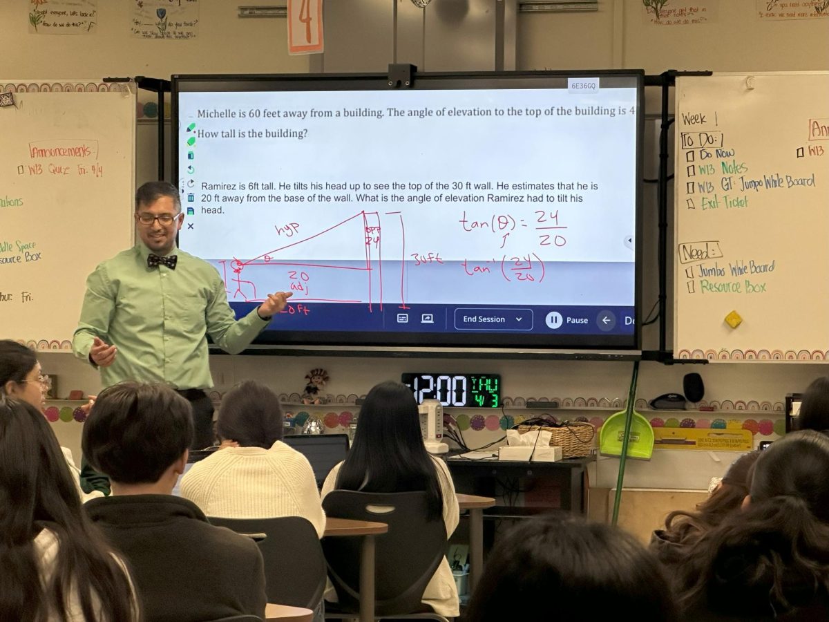 Math 2 teacher, Pedro Ramirez, teaches a lesson on trigonometry using real-world examples.  “It gives a lot of access to a lot of students to get more education as far as it goes, like to get college credit before they even go into a college,” Ramirez said. “Also helps decrease the equity gap we have with other more economically advantaged areas.