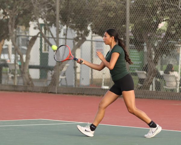  Against Palma, senior Jazlene Meza hits a forehand against Palma’s singles. The Trojans won this crucial match, improving their record in league to 4-4. “Personally being 6-1 this season so far has been really encouraging and this was overall a great collective team win,” Meza said.