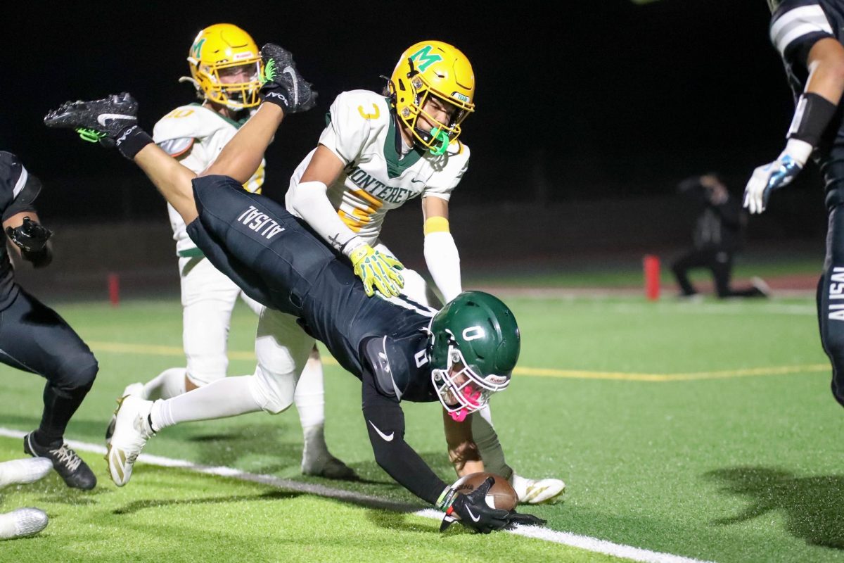 Senior Jayden Duarte dives across the goal line for one of his five touchdowns in a dominant 62-40 victory over Monterey. It has been a highly successful season for Duarte, and he credits his coaches for putting him in positions to succeed and make key plays. “The goal is to help wherever the coaches need me, receiver, running back, [and] DB,” he said. 
