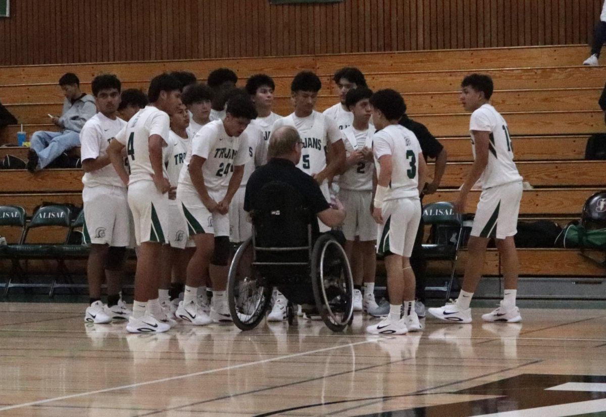 Against Alvarez, Coach Brad Ashby addresses the team. The final score was 65-9 and it was definitely a huge win for the boys. ”He’s been a student of the game,” Athletic Director and varsity boys’ basketball coach Jose Gil said.
