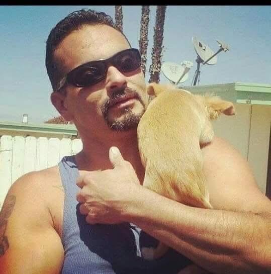 My Tio, Tino Lucio Jr., with his dog Jake in a family photo taken by my mother.