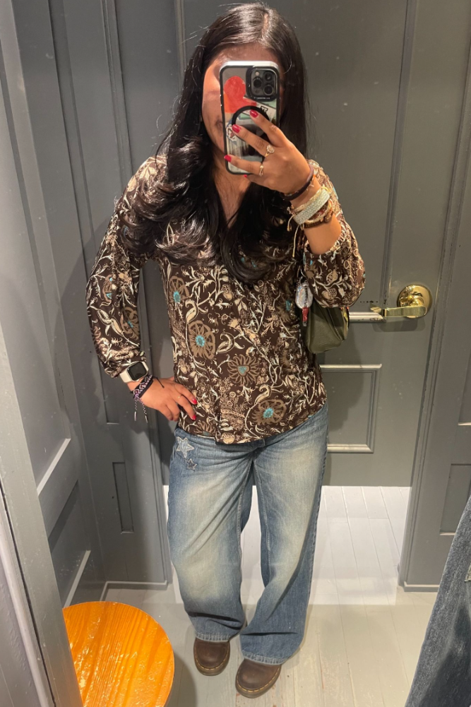 I went to the Hollister fitting room to take a picture of my shirt because I really liked it. I actually bought the shirt the day before at Goodwill on E. Alisal for $6.99.